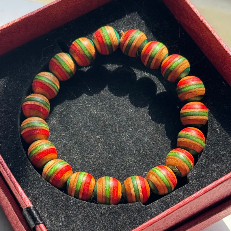 Handmade recycled skateboard Red, Green, Teal & Orange Striped Bead Bracelet — Baltic Dew, made in the UK