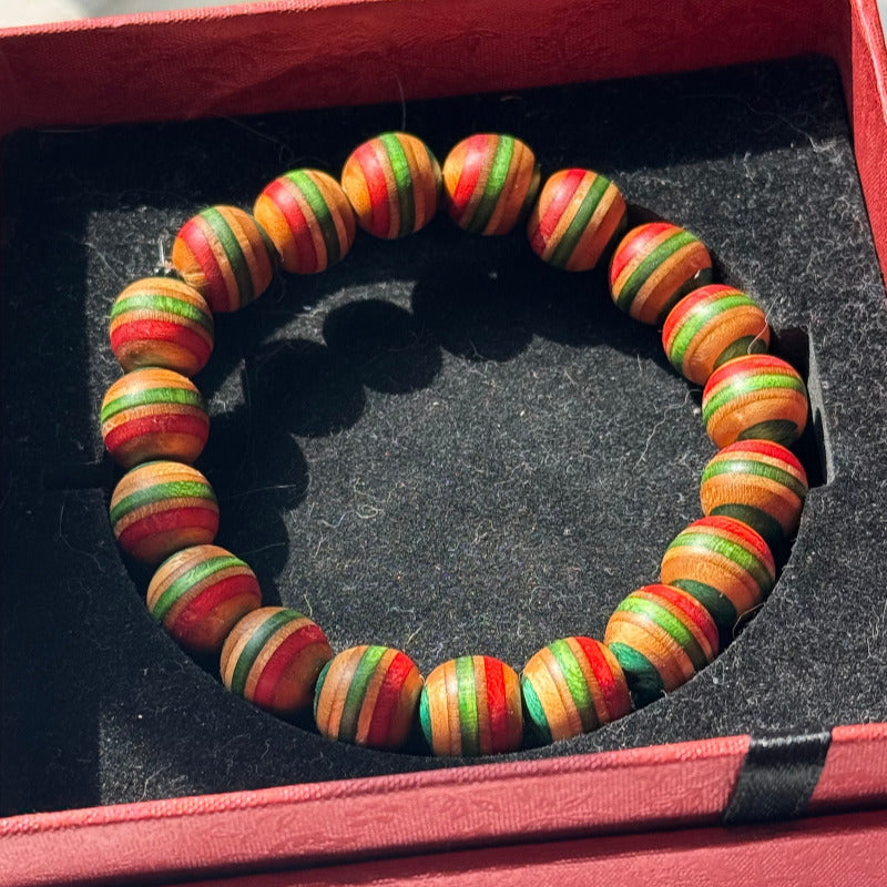 Handmade recycled skateboard Red, Green, Teal & Orange Striped Bead Bracelet — Baltic Dew, made in the UK