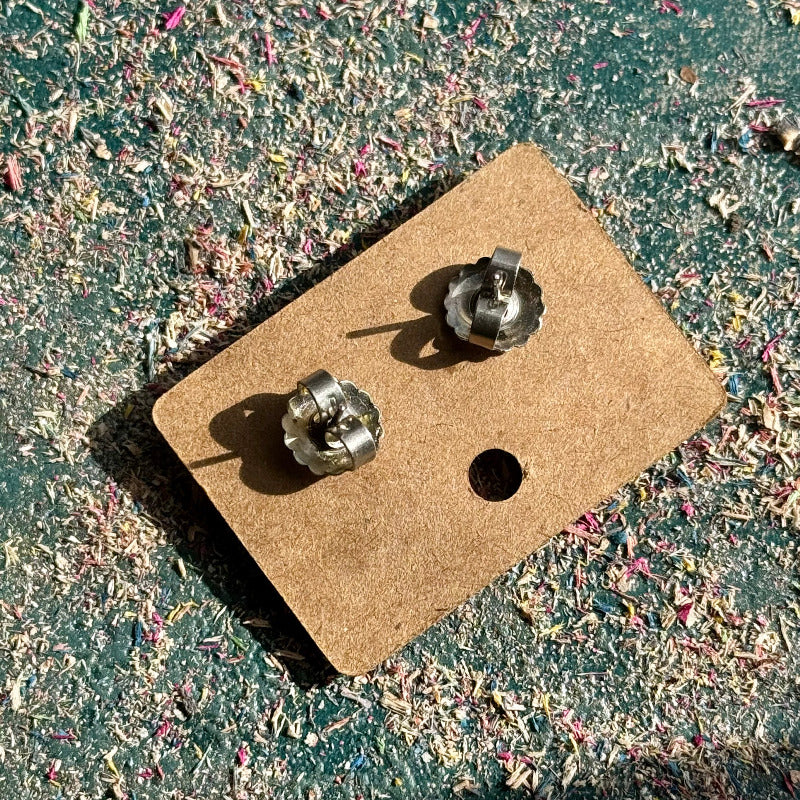 A multicolour layered ring made from recycled skateboard wood with glossy CA glue finish, handmade by Baltic Dew