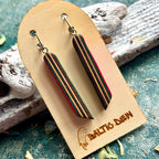 Pink and purple recycled skateboard long drop earrings with cream stripes running down each bar