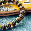 Black, yellow and green skateboard maple beads, each one handcut and sanded by Baltic Dew.