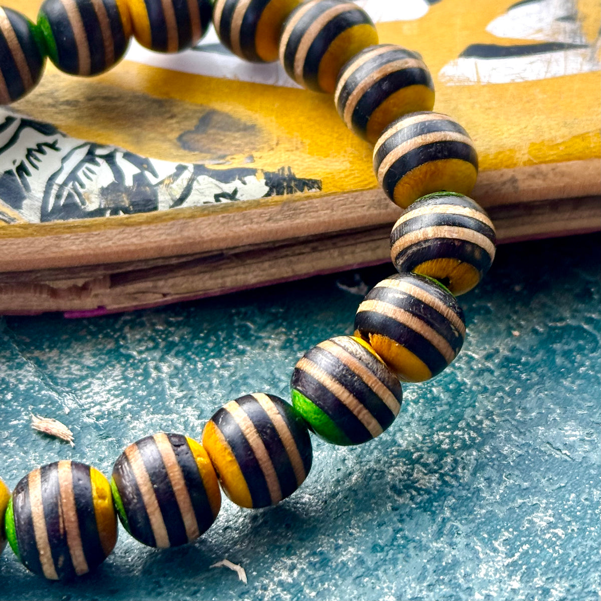 Black, yellow and green skateboard maple beads, each one handcut and sanded by Baltic Dew.