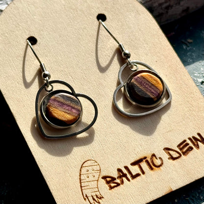 Round drop earrings with dark layered skateboard wood inlays set inside open metal frames.