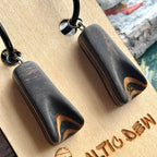 Black skateboard wood hoop drops on black hoops with pale maple in the carved tip, handmade by Baltic Dew