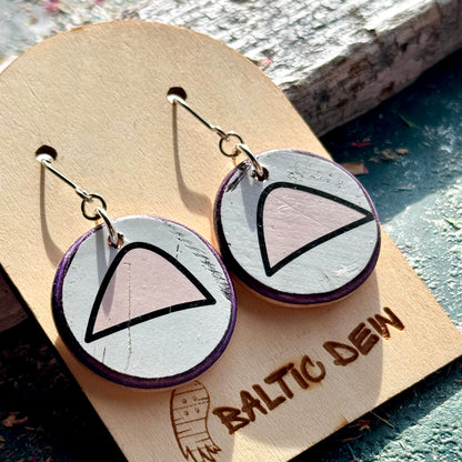 White and pink recycled skateboard wood drop earrings showing cat ears from the deck graphic