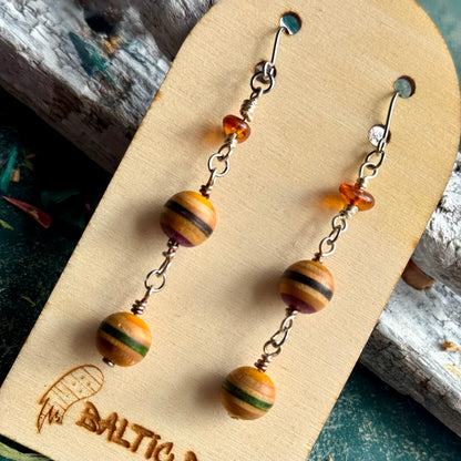 Close view of the Lithuanian Baltic amber at the top of a recycled skateboard wood drop earring