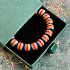 Blue and red recycled skateboard wood beaded bracelet in a Baltic Dew gift box