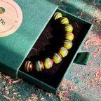 Green, teal and brown recycled skateboard wood bead bracelet, handmade by Baltic Dew.