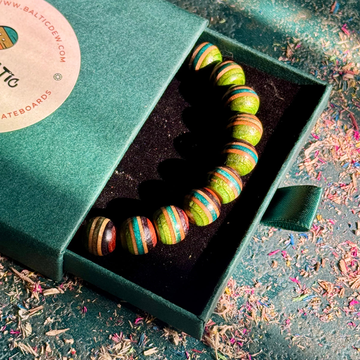 Green, teal and brown recycled skateboard wood bead bracelet, handmade by Baltic Dew.