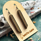 Black recycled skateboard long drop earrings with narrow cream stripes along the slim wooden bars