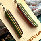 Close view of green, teal and brown striped skateboard wood long drop earrings, by Baltic Dew
