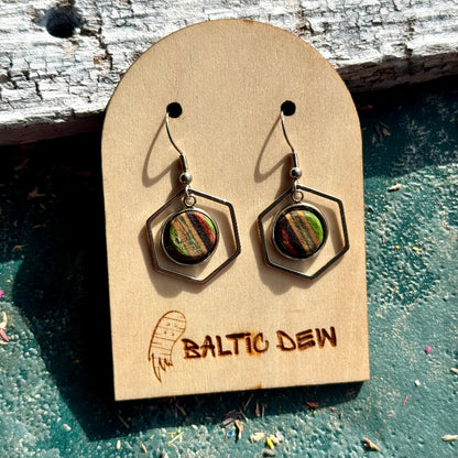 Hexagon drop earrings with recycled skateboard wood inlays showing green, red and natural maple bands.