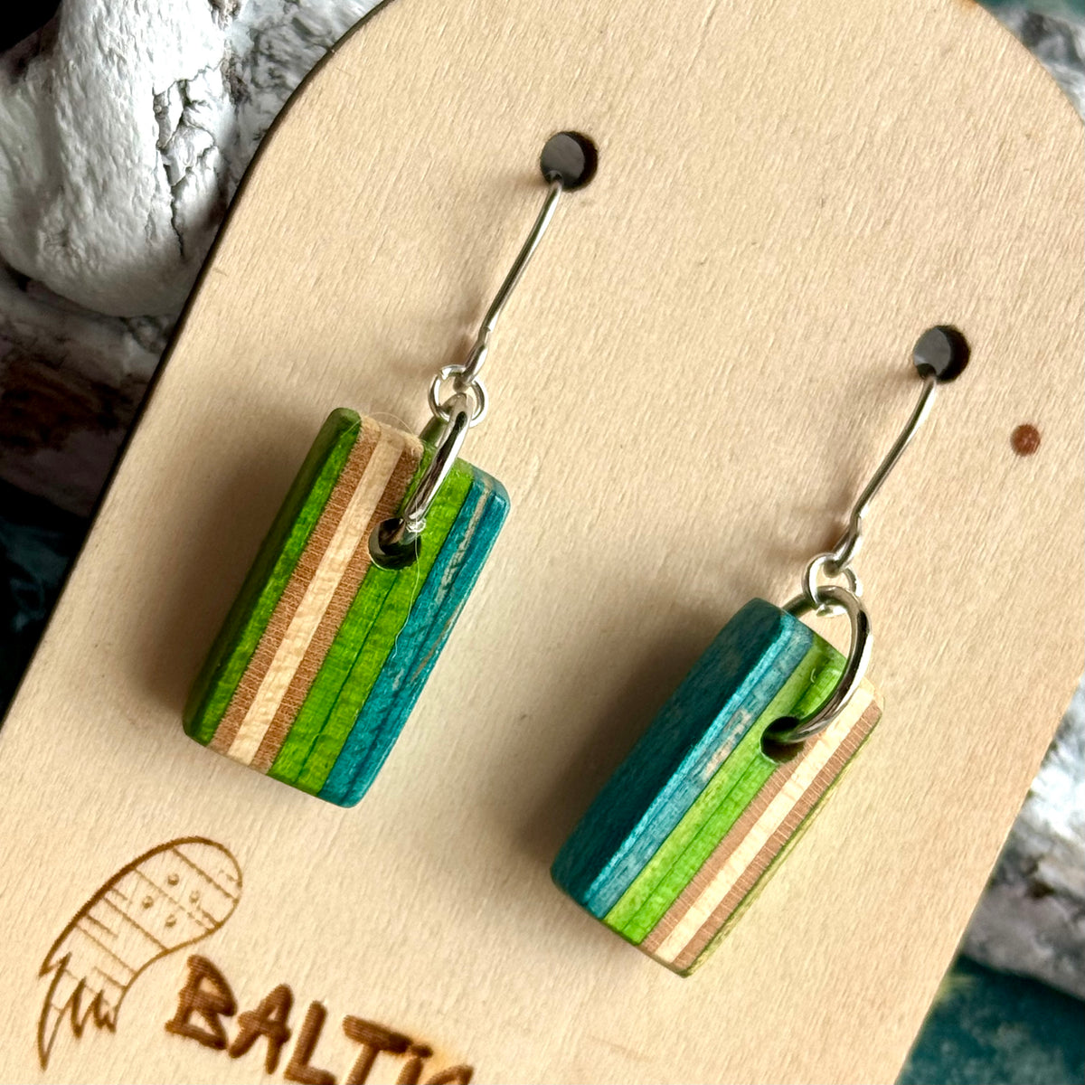 Green and teal vertical stripe wooden drop earrings on surgical steel hooks, handmade by Baltic Dew