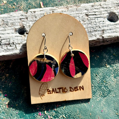 Pink and black round recycled skateboard wood earrings on surgical steel hooks, handmade by Baltic Dew