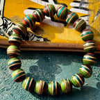 Green, teal and brown skateboard maple beads strung on elastic, handcut and sanded by Baltic Dew.