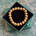 Yellow and black recycled skateboard wood beaded bracelet in a Baltic Dew gift box