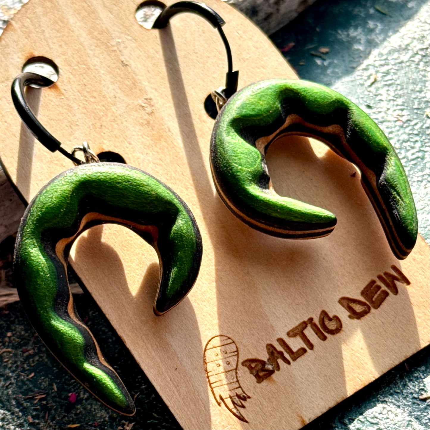 Green recycled skateboard wood spiral earrings carved from layered maple, handmade by Baltic Dew