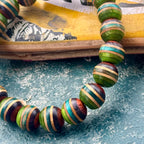 Green, teal and brown striped beads from recycled skateboard maple, handmade by Baltic Dew.