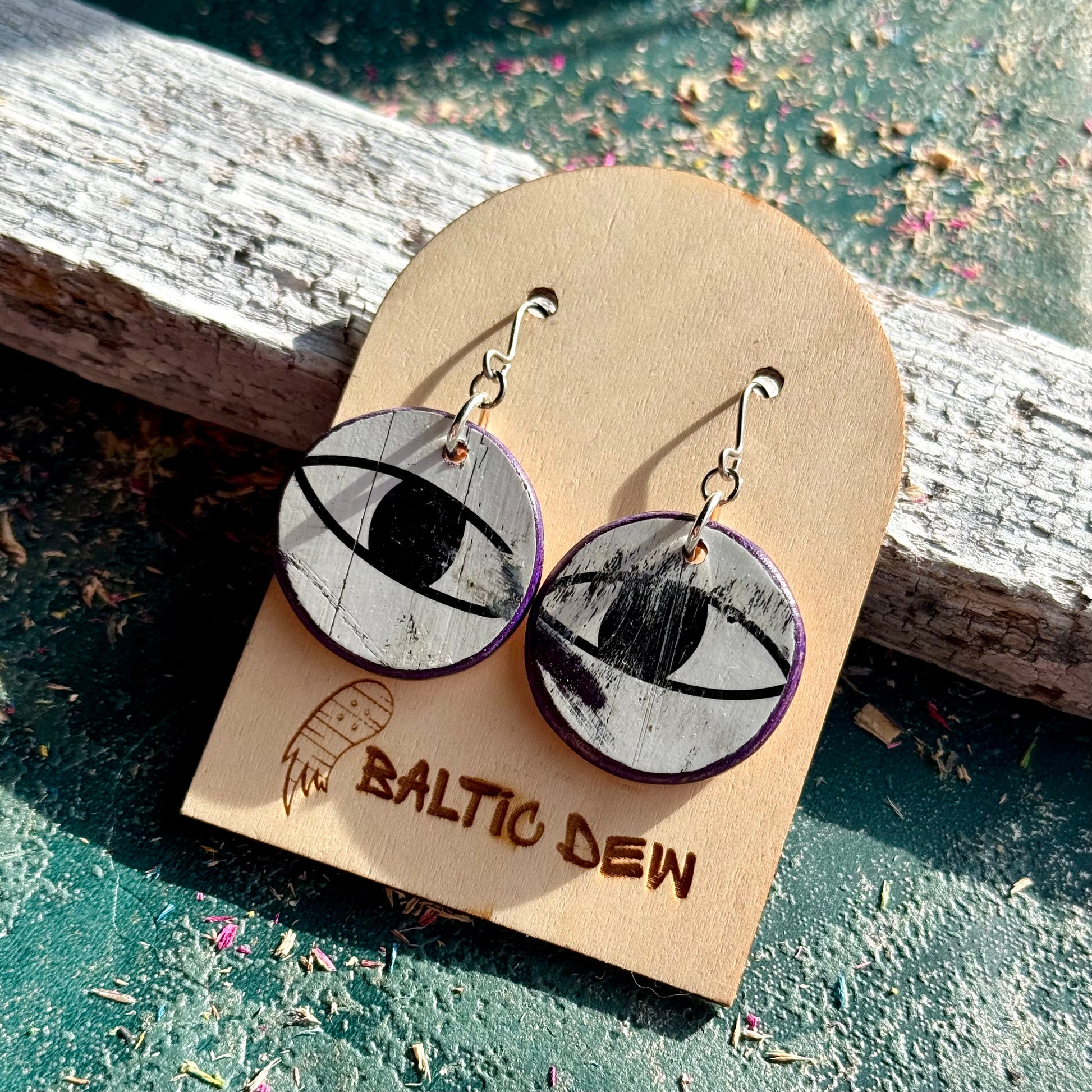 Black and white cat eye skateboard wood drop earrings on surgical steel hooks, handmade by Baltic Dew
