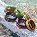 Several multicolour skateboard maple rings together, showing the colour directions available to order.