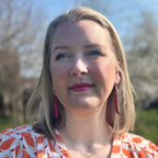 Lightweight handmade long drop earrings shown being worn for length and scale.