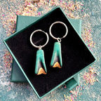 Teal and black wooden hoop earrings on silver stainless steel hoops