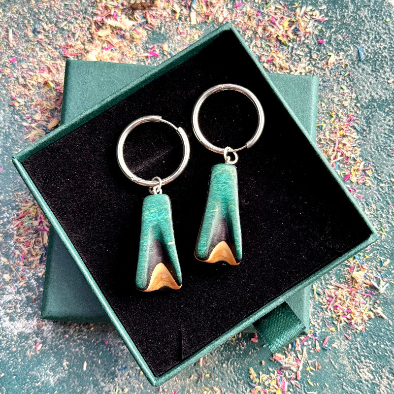 Teal and black wooden hoop earrings on silver stainless steel hoops