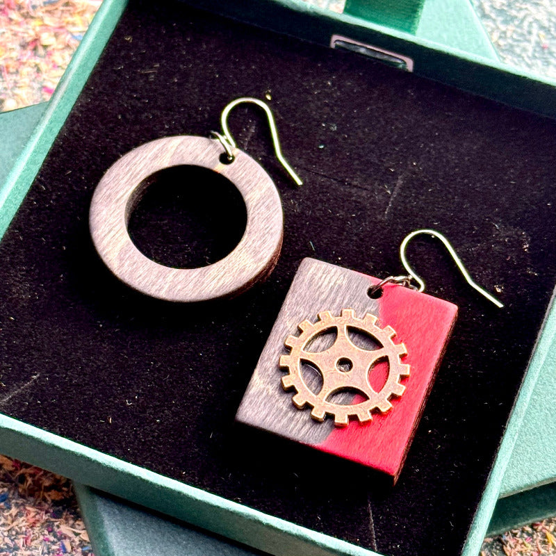 A multicolour layered ring made from recycled skateboard wood with glossy CA glue finish, handmade by Baltic Dew