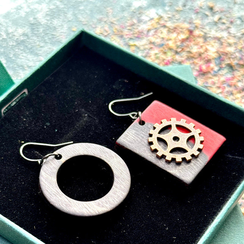 A multicolour layered ring made from recycled skateboard wood with glossy CA glue finish, handmade by Baltic Dew