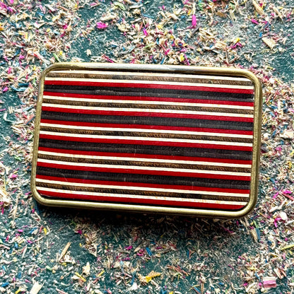 belt buckle, A multicolour layered jewellery piece made from recycled skateboard wood, handmade by Baltic Dew with.