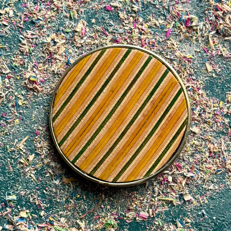 belt buckle, A multicolour layered jewellery piece made from recycled skateboard wood, handmade by Baltic Dew with.