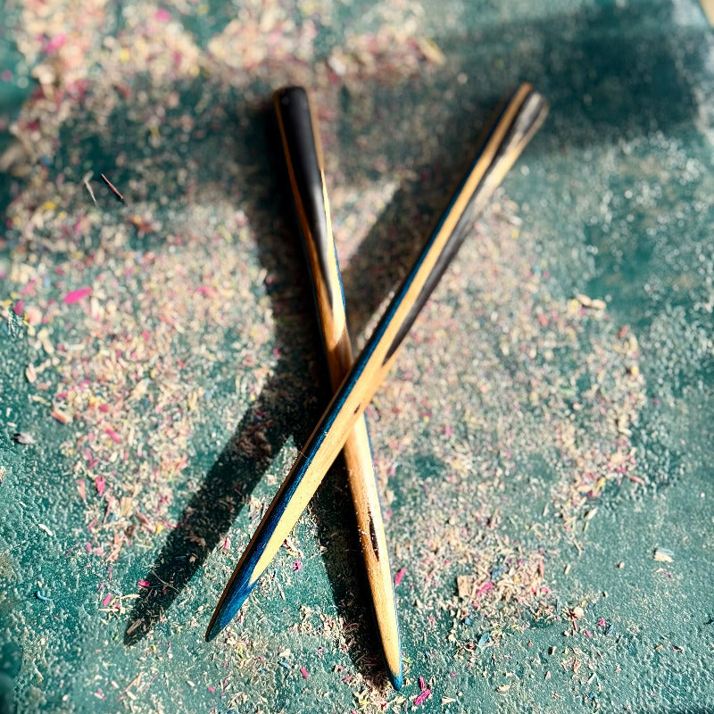A multicolour layered hair stick made from recycled skateboard wood with oiled wooden finish, handmade by Baltic Dew