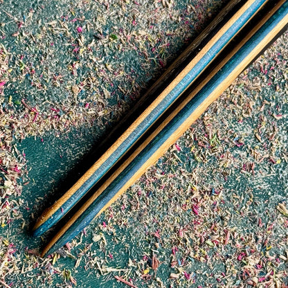 A multicolour layered hair stick made from recycled skateboard wood with oiled wooden finish, handmade by Baltic Dew