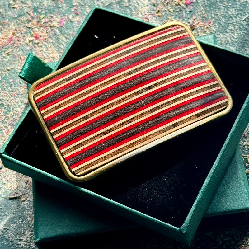 belt buckle, A multicolour layered jewellery piece made from recycled skateboard wood, handmade by Baltic Dew with.