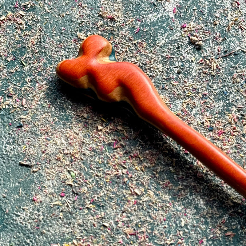 A multicolour layered hair stick made from recycled skateboard wood with oiled wooden finish, handmade by Baltic Dew