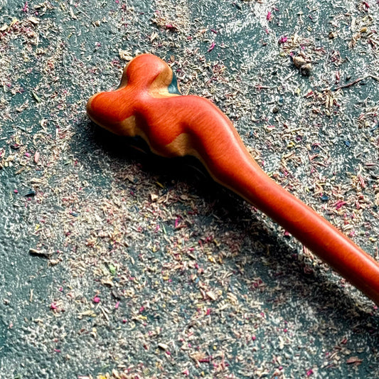 A multicolour layered hair stick made from recycled skateboard wood with oiled wooden finish, handmade by Baltic Dew