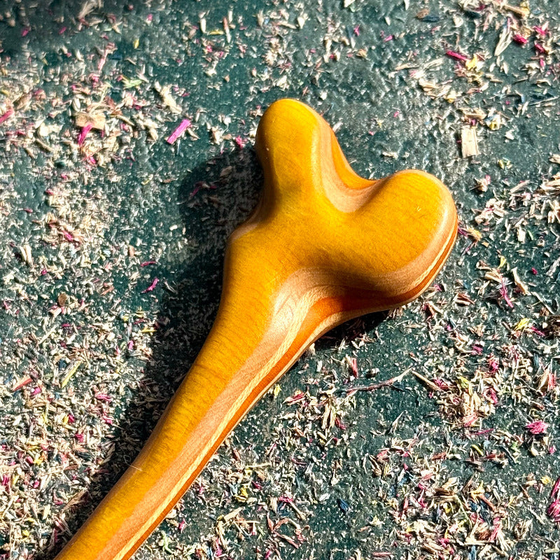 Yellow and Orange Skateboard Hair Stick made from polished recycled skateboard wood with smooth curved design
