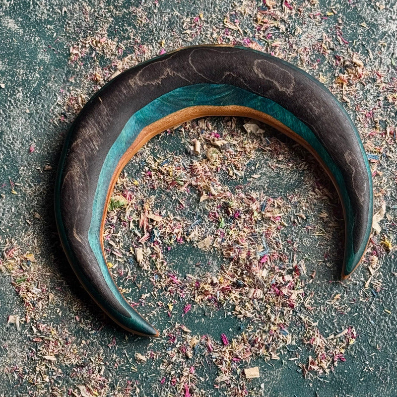 Teal and Black Moon Skateboard Hair Fork made from layered recycled skateboard wood with curved crescent shape