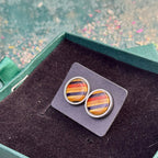 Red and blue 14mm layered maple stud earrings with visible skateboard wood grain