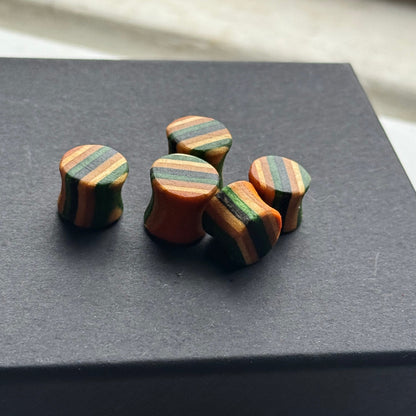 Handmade recycled skateboard Green & Black Striped Ear Plugs – 10mm — Baltic Dew, made in the UK