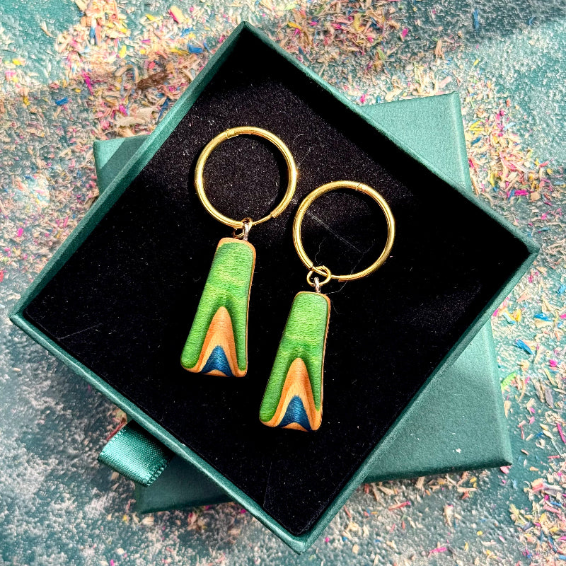 Green layered wood hoop earrings with black stainless steel hoops.
