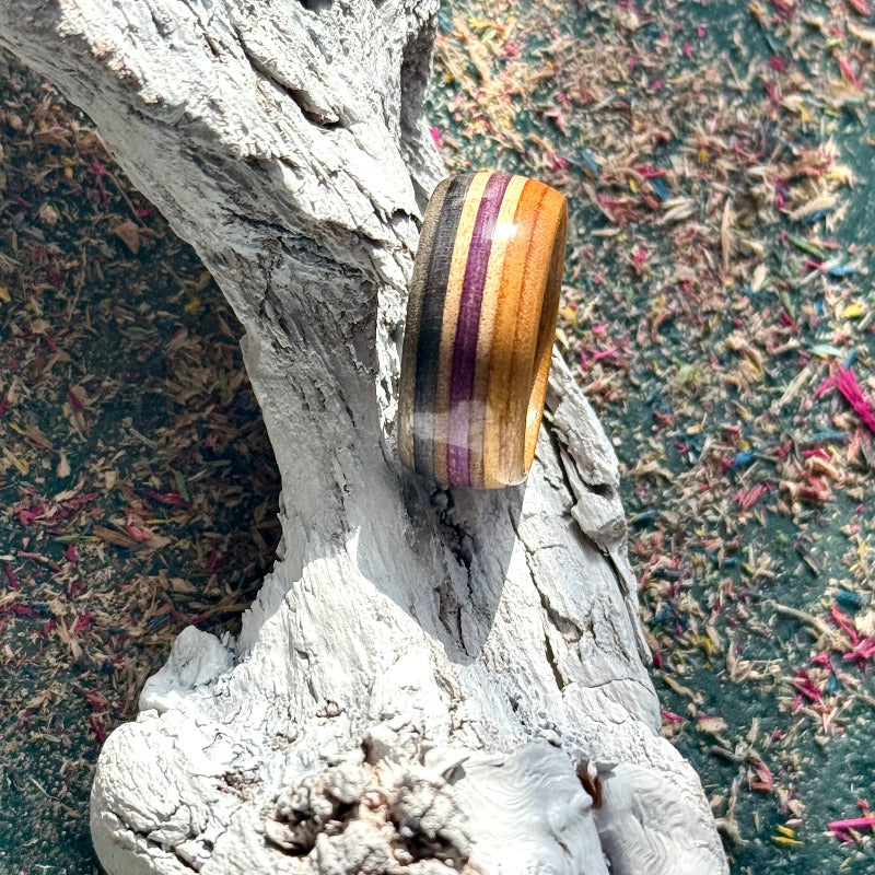 Skateboard maple ring showing purple and black striped layers.