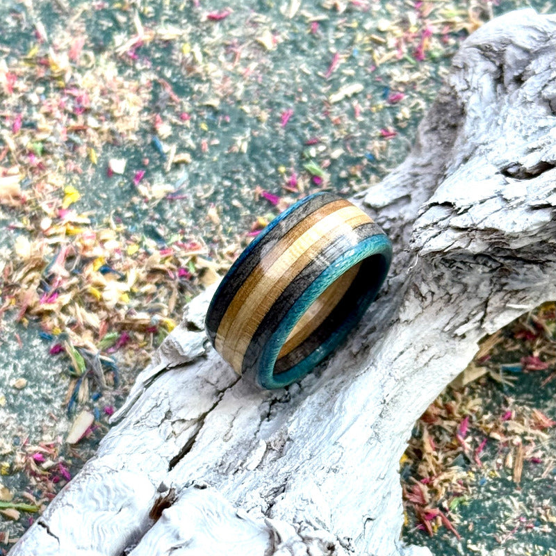 Skateboard maple ring showing blue and black layers from the side.