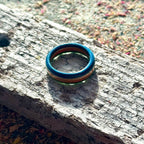 Slim skateboard maple ring showing the natural and coloured layers from the side.