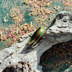 Slim skateboard maple ring with green, purple and teal stripes.