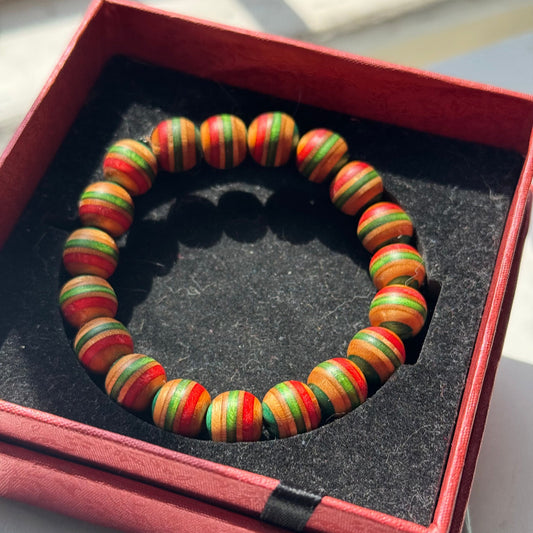 Handmade recycled skateboard Red, Green, Teal & Orange Striped Bead Bracelet — Baltic Dew, made in the UK