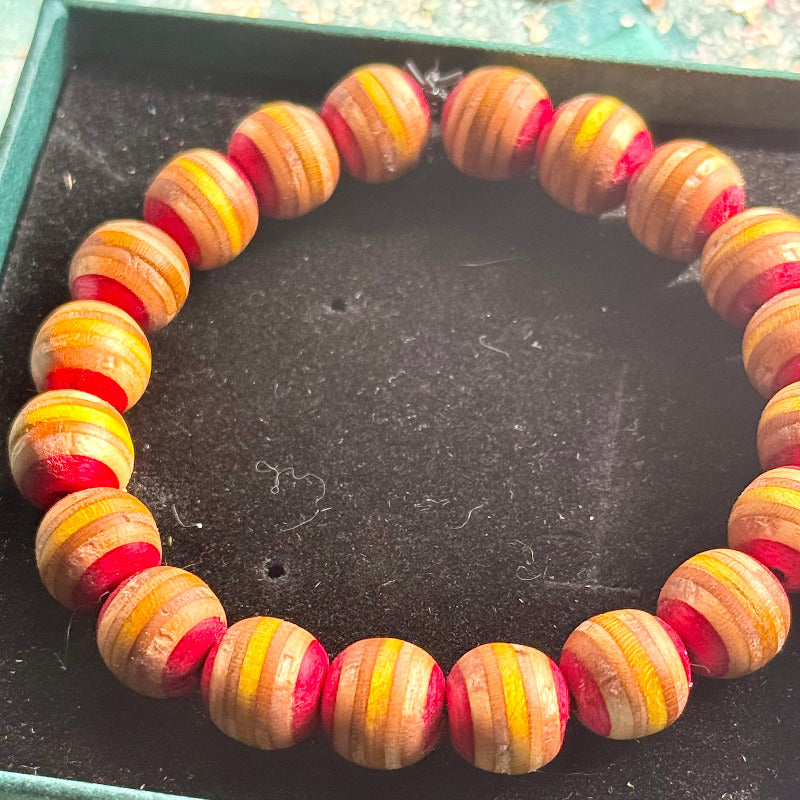 Handmade recycled skateboard Red and Yellow Skateboard Bracelet — Baltic Dew, made in the UK